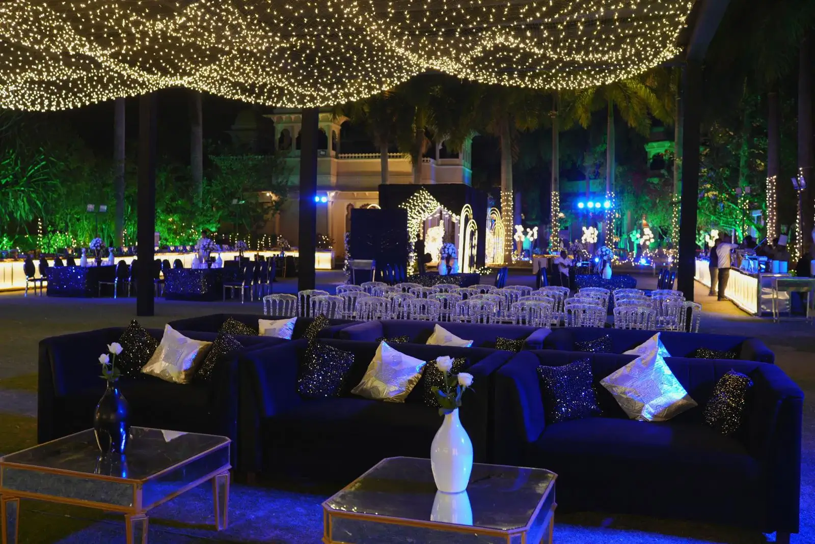 Modern Indian wedding décor featuring a floral Mandap, warm lighting, coordinated colours and traditional decorative elements